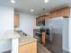 Stainless steel appliances and wood cabinets in kitchen at 275 Jackson St, Goose Creek, SC 29445
