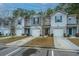 Row of townhouses with attached garages and landscaping at 275 Jackson St, Goose Creek, SC 29445