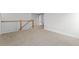 Neutral hallway with wood and white stair rail and neutral carpet, leading to bedrooms at 323 Hillman Trl Dr, Moncks Corner, SC 29461