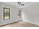 Bright bedroom featuring hardwood floors, neutral walls, and a modern ceiling fan at 3874 Srevir Rd, Johns Island, SC 29455