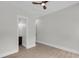 Well-lit bedroom boasts wood floors, neutral walls and trim, and access to an en suite bathroom at 3874 Srevir Rd, Johns Island, SC 29455