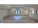 Large bonus room with hardwood floors and multiple windows at 3874 Srevir Rd, Johns Island, SC 29455
