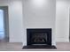 Modern fireplace with herringbone brick and dark surround at 3874 Srevir Rd, Johns Island, SC 29455