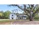 Charming home with mature trees, a well-manicured lawn, and a beautiful front exterior, exuding curb appeal at 3874 Srevir Rd, Johns Island, SC 29455