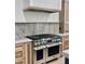 Stainless steel range, hood, and countertops in modern kitchen at 3874 Srevir Rd, Johns Island, SC 29455