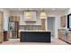 Spacious kitchen with island, stainless steel appliances, and light wood cabinets at 3874 Srevir Rd, Johns Island, SC 29455