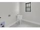 Functional laundry room featuring a white utility sink, ample light, and trim at 3874 Srevir Rd, Johns Island, SC 29455