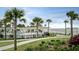 Resort-style pool area with palm trees and beach access at 4021 Bridle Dr, Johns Island, SC 29455