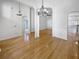 Bright dining room with hardwood floors and access to other rooms at 606 Pointe Of Oaks Rd, Summerville, SC 29485