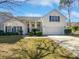 Two-story house with a two car garage and manicured lawn at 606 Pointe Of Oaks Rd, Summerville, SC 29485