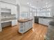 Updated kitchen with white cabinets, granite countertops and an island at 606 Pointe Of Oaks Rd, Summerville, SC 29485