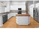 Modern kitchen with white cabinets, granite countertops and a center island at 606 Pointe Of Oaks Rd, Summerville, SC 29485