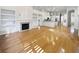 Open concept living space with hardwood floors and a fireplace at 606 Pointe Of Oaks Rd, Summerville, SC 29485