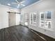 Sunroom featuring a barn door, tile floor, and multiple windows at 606 Pointe Of Oaks Rd, Summerville, SC 29485
