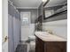 Clean bathroom with shower/tub combo, vanity with a marble top, and gray walls at 8626 Vistavia Rd, North Charleston, SC 29406