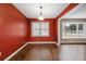 Dining room with red walls and hardwood floors at 8626 Vistavia Rd, North Charleston, SC 29406