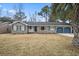 Brick ranch house with attached garage and landscaped lawn at 8626 Vistavia Rd, North Charleston, SC 29406