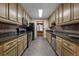 Galley kitchen with granite countertops and stainless steel appliances at 8626 Vistavia Rd, North Charleston, SC 29406