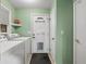 Laundry room with washer, dryer, and exterior access at 8626 Vistavia Rd, North Charleston, SC 29406