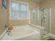 Bathroom with a garden tub, separate shower, and updated fixtures at 104 Pavilion St, Summerville, SC 29483
