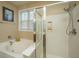 Bathroom includes a shower and tub combo, and a large window at 104 Pavilion St, Summerville, SC 29483