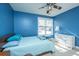 Blue bedroom with double bed, window, and dresser at 104 Pavilion St, Summerville, SC 29483