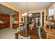 Bright dining room features a spacious table and chairs, hardwood floors, and access to kitchen at 104 Pavilion St, Summerville, SC 29483
