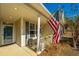 Inviting front porch with American flag and rocking chair at 104 Pavilion St, Summerville, SC 29483