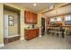Kitchen with breakfast bar, wood cabinets, and tile flooring at 104 Pavilion St, Summerville, SC 29483