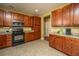 Kitchen boasts ample wood cabinets, stainless steel appliances, and tile flooring at 104 Pavilion St, Summerville, SC 29483