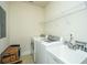 Bright laundry room with washer, dryer, and utility sink at 104 Pavilion St, Summerville, SC 29483