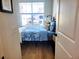 Cozy bedroom with light blue bedding and wood flooring at 123 Leeward Lndg, Summerville, SC 29486