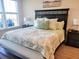 King-size bed in a spacious bedroom with large window and light decor at 123 Leeward Lndg, Summerville, SC 29486