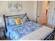 Bright bedroom with blue bedding, yellow pillows and wood floor at 123 Leeward Lndg, Summerville, SC 29486