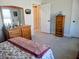 Bedroom with floral bedding, wooden dresser and carpet flooring at 123 Leeward Lndg, Summerville, SC 29486