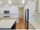 Kitchen featuring white cabinets, stainless steel appliances, and a hardwood floor at 123 Leeward Lndg, Summerville, SC 29486