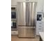 Stainless steel refrigerator with freezer and copper handles in a modern kitchen setting at 123 Leeward Lndg, Summerville, SC 29486