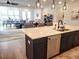 Open concept kitchen with island and views into living room at 123 Leeward Lndg, Summerville, SC 29486