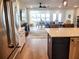 Open concept kitchen with island and views into living room at 123 Leeward Lndg, Summerville, SC 29486