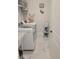 Bright laundry room with washer, dryer, marble flooring and shelving at 123 Leeward Lndg, Summerville, SC 29486