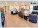 Open concept living space with hardwood floors and views into kitchen area at 123 Leeward Lndg, Summerville, SC 29486