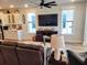 Spacious living area with hardwood floors, large TV, and plenty of natural light at 123 Leeward Lndg, Summerville, SC 29486