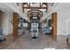 Grand community space with high ceilings, wood beams, herringbone floors, and comfortable seating areas at 123 Leeward Lndg, Summerville, SC 29486