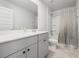 Bathroom with grey vanity, single sink, and shower/tub combo at 134 Vistawood Dr, Charleston, SC 29414