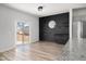 Bright dining area with sliding glass door to patio, modern wall design, and hardwood floors at 134 Vistawood Dr, Charleston, SC 29414