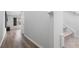 Light hallway with hardwood floors and staircase leading upstairs at 134 Vistawood Dr, Charleston, SC 29414