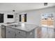 Modern kitchen with granite island, stainless steel appliances, and sliding doors to patio at 134 Vistawood Dr, Charleston, SC 29414