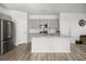 Modern kitchen with gray cabinets, granite island, and stainless steel appliances at 134 Vistawood Dr, Charleston, SC 29414