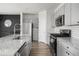 Modern kitchen with gray cabinets, granite countertops, and stainless steel appliances at 134 Vistawood Dr, Charleston, SC 29414