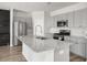 Modern kitchen with gray cabinets, granite island, and stainless steel appliances at 134 Vistawood Dr, Charleston, SC 29414